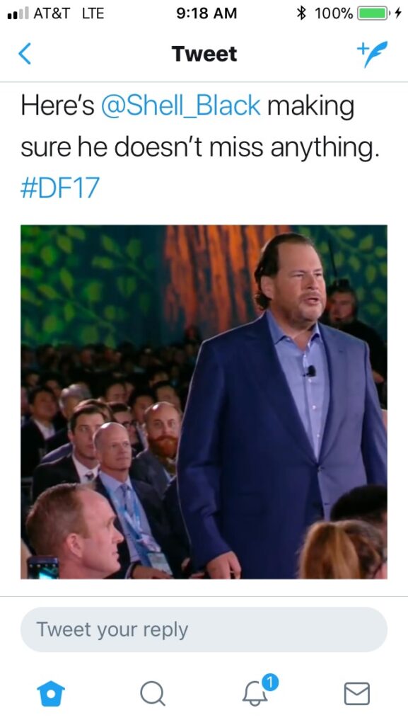 a screenshot of Dreamforce tweet showing Shell in the background
