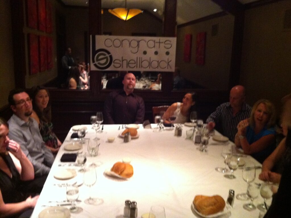 picture of a table with banner in backImage that captured the start of the Shell Black Salesforce story